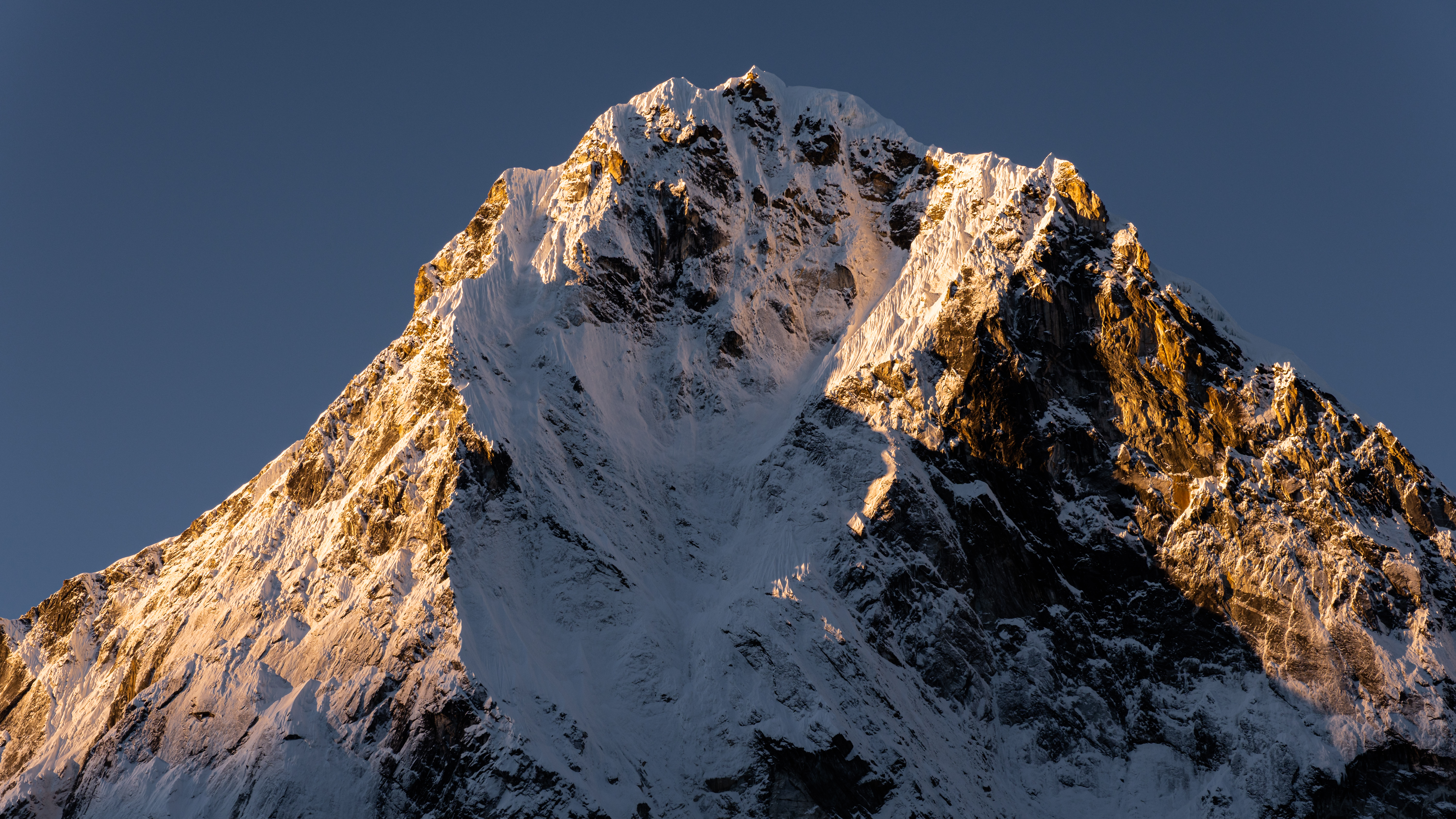 #width=100%;max-width=800px;margin-left=auto;margin-right=auto; The north face of Cho La Tse catches the morning light.