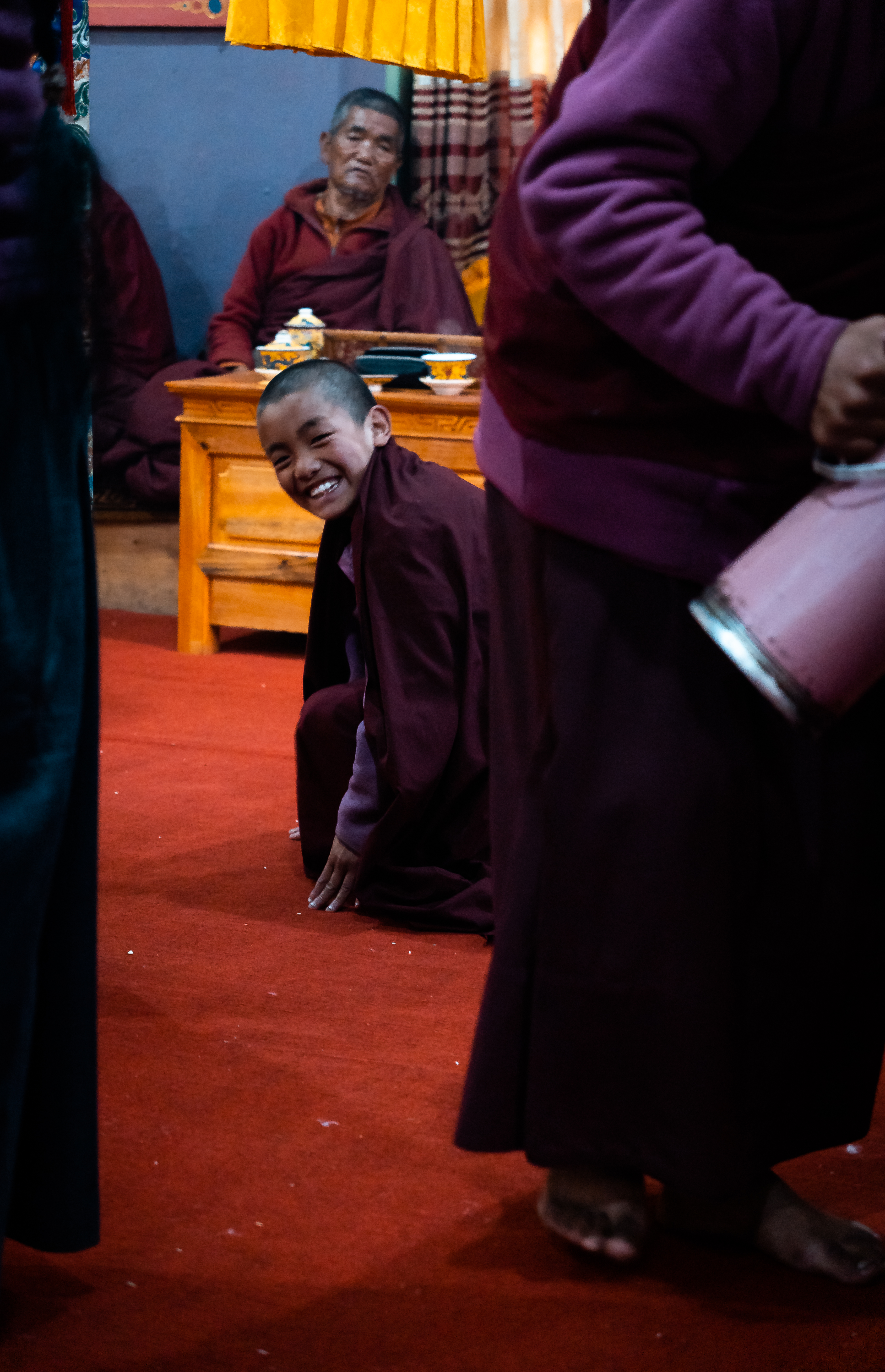 #width=100%;max-width=400px;margin-left=auto;margin-right=auto; Lhakpa Kaji shoots me a cheesy grin as he pays his respects during the Panggom Duwa Puja ceremony.