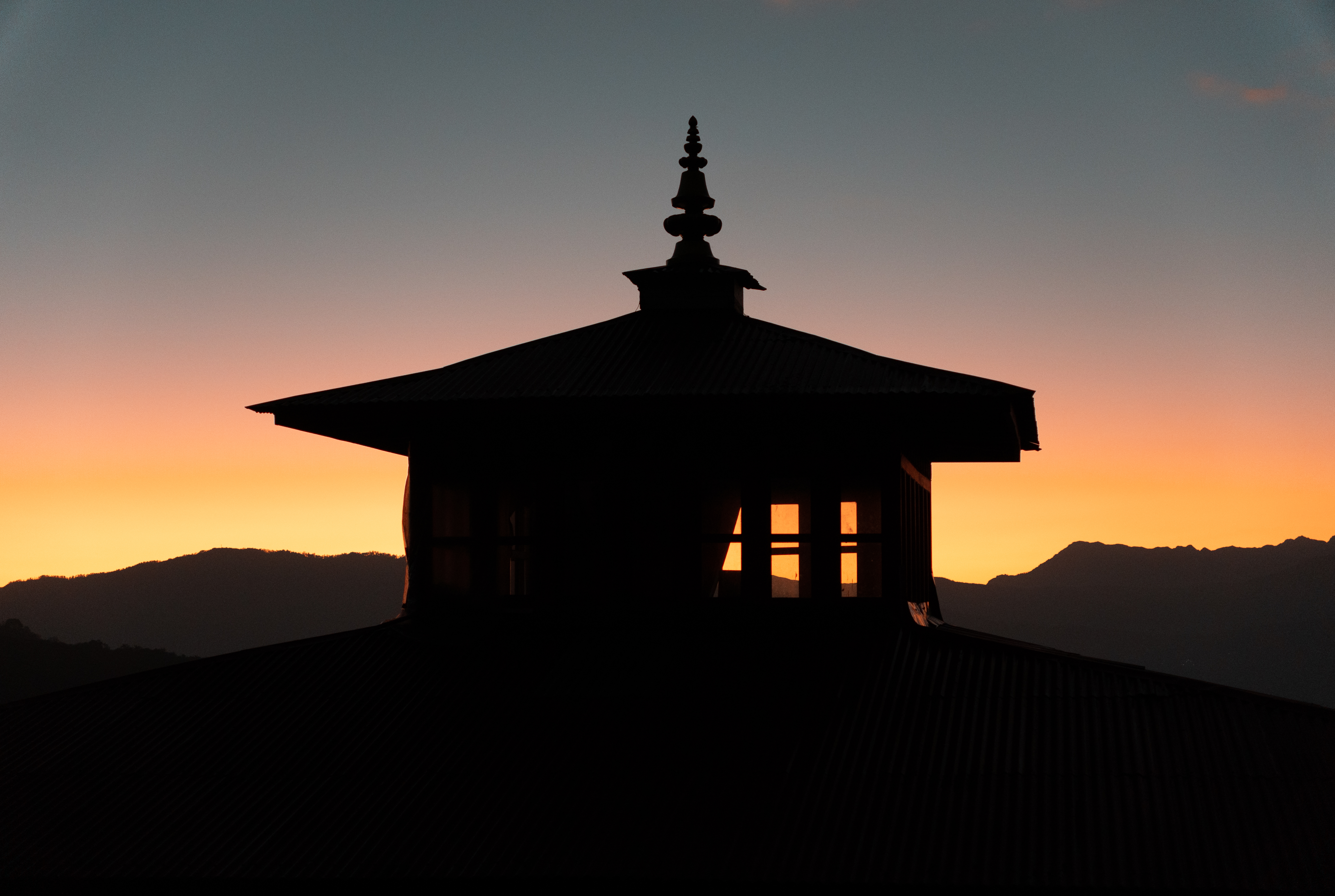 #width=100% The Tashi Sangag Chholing Gumba framed against a rare cloudless sunset.