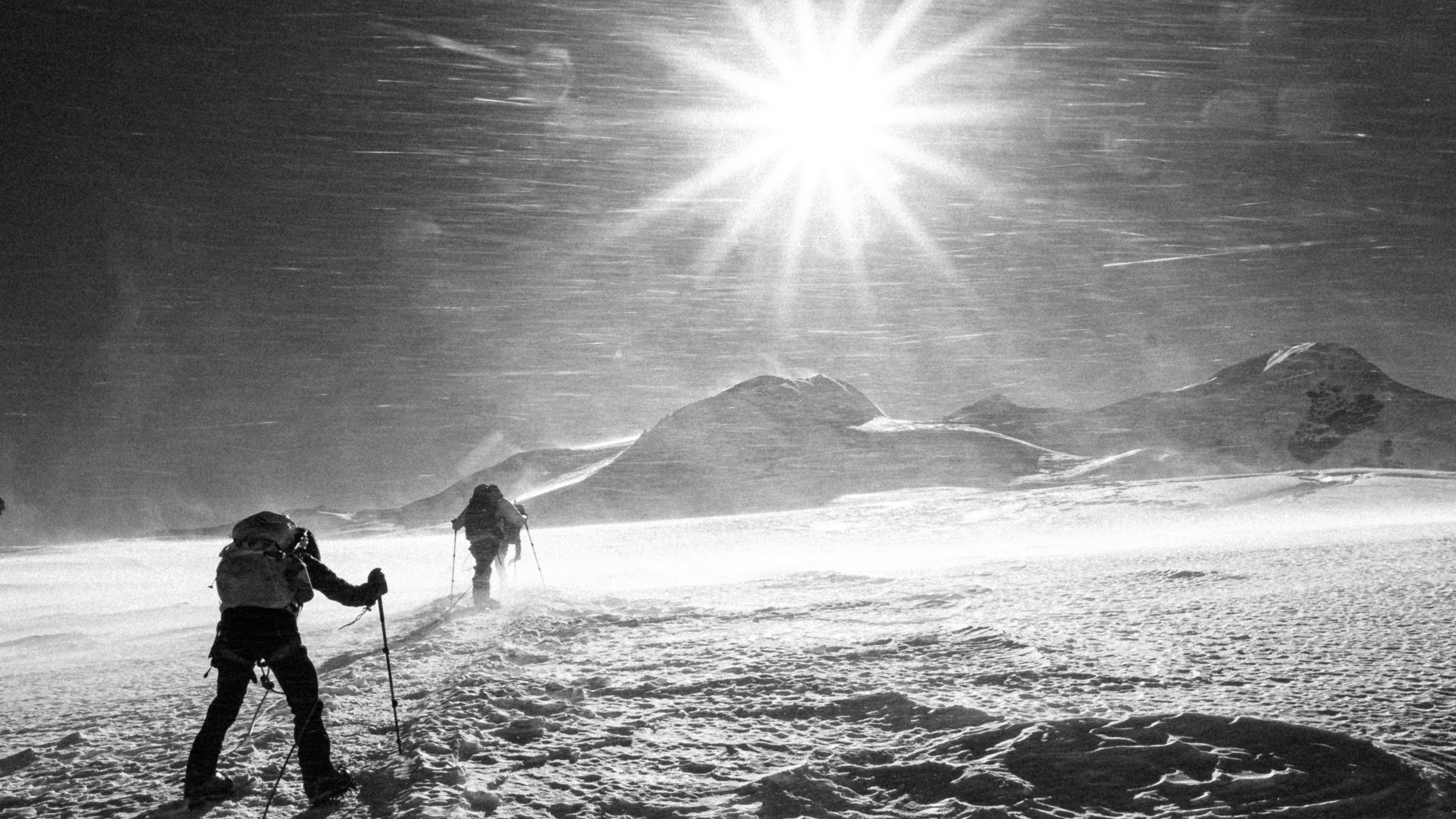 #width=100% Bracing ourselves as the wind pelts us with snow on the path to Mera Peak high camp.